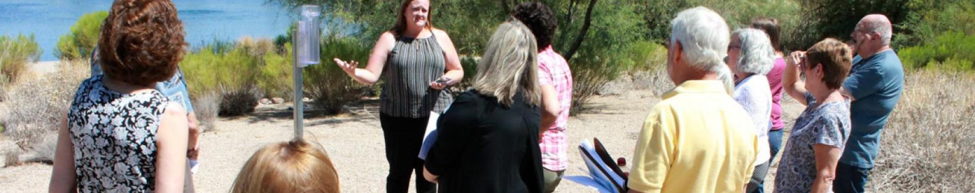 Person talking to a group of others